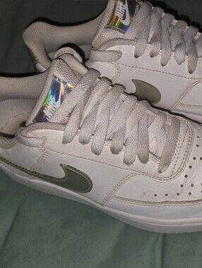 Nike Women’s White Sneakers with Holographic Swoosh